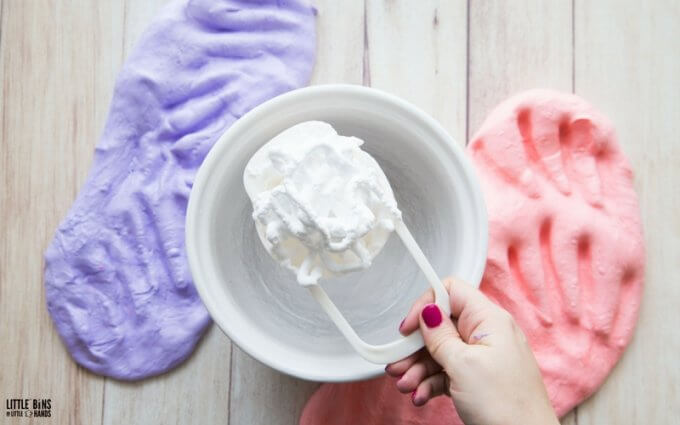 adding shaving cream to bowl for fluffy slime