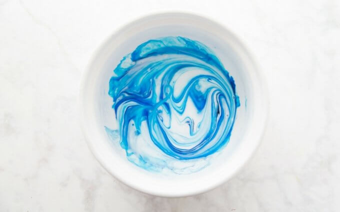 Liquid starch slime colored with blue food coloring