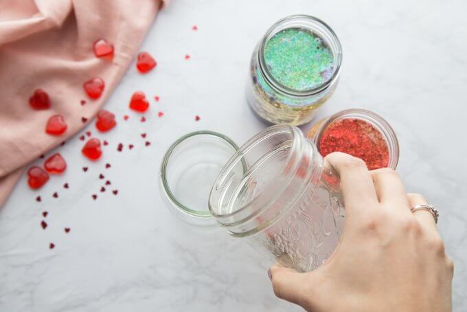 Add oil and water to jar for homemade lava lamp DIY science project