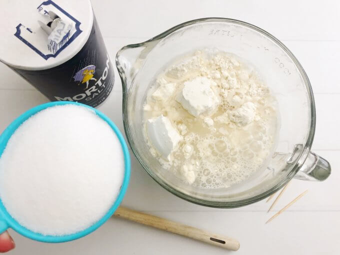 Adding ingredients into bowl for salt dough making